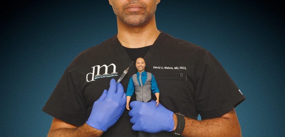 Dr. Mabrie with syringe and male doll.