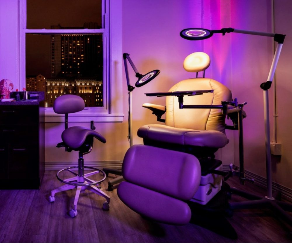 Treatment room at Mabrie Facial Institute, illuminated in a purple light.