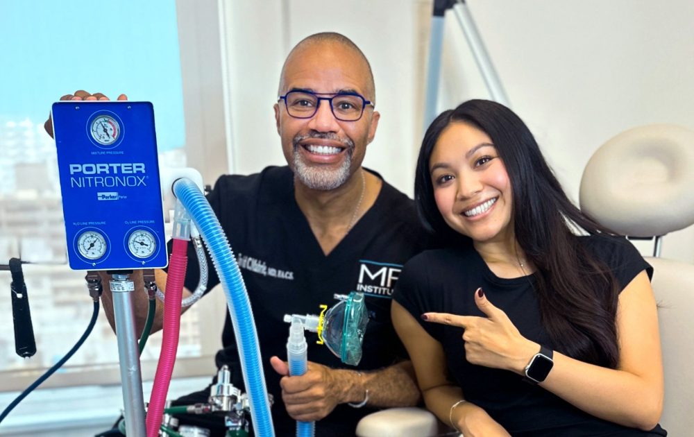 Dr Mabrie and clinician showcasing machine
